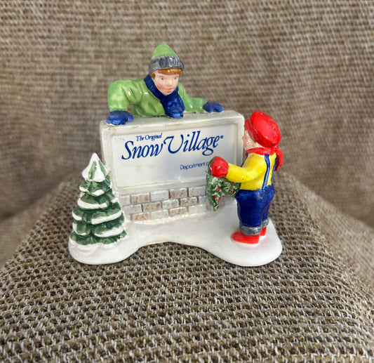Kids Decorating the Village Sign